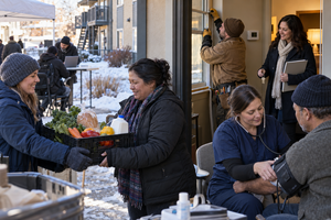 Idaho community assistance event with groceries, a health check, home weatherization, housing keys, and employment support.