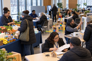 Minnesota winter benefits outreach event with food, health coverage, child care, energy, and housing assistance stations.